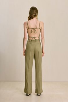 A corset-style top with boning and two back ties with adjustable straps. — Scoop neckline — Open back with functional ties — Subtle v-shaped hem — Wear with the Lindsey Pant Chic Strapped Bottoms For Summer, Chic Summer Bottoms With Straps, Chic Bottoms With Straps For Summer, Chic Fitted Bottoms With Tie Back, Spring Backless Bottoms With Tie Back, Chic Fitted Bottoms With Adjustable Straps, Fitted Bottoms With Adjustable Straps For Spring, Corset Style Tops, Autumn Sales