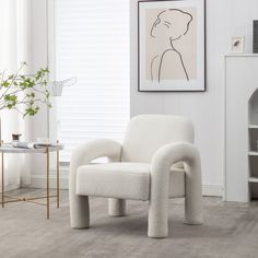 a white chair sitting in a living room next to a fireplace