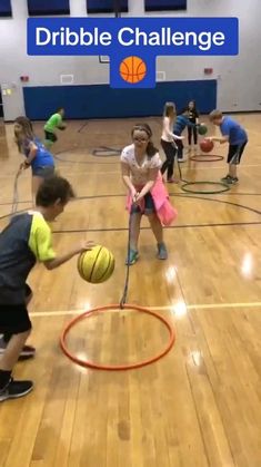 young children playing basketball in an indoor gym with the words dribble challenge above them