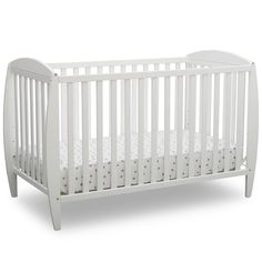 a white crib with no mattress in the front and side rails on the sides