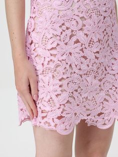 a close up of a woman's pink lacy skirt