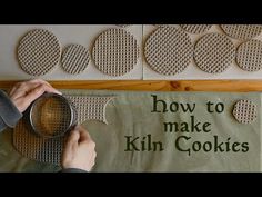 a person holding a magnifying glass over a sign that says how to make kiln cookies