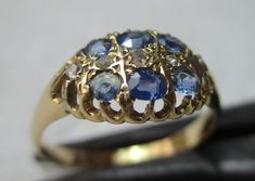 Quality early Edwardian 18ct solid gold diamond and sapphire gemstone ring. The head of the ring is marquise shaped, size 10.0mm{North to South} x 12.0mm{East to West} and is encrusted with rows of light blue sapphire gemstones and diamond gemstone chips, sandwiched between. All of the gemstones are in top condition and exposed to the ring's reverse side to allow the light to shine through to make them glow, also for easy cleaning access. The shank is straight and displays a full striking Birmin Light Blue Sapphire, Sapphire Gemstone, Precious Gemstones, Diamond Gemstone, Gemstone Ring, Rings Statement, Birmingham, Blue Sapphire, Easy Cleaning