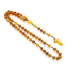 Amber Catholic rosary. These semi-precious Baltic amber rosary beads in the colors shown in the foto. In addition, we enriched it with delicate details - a hand-carved rose flower made of real Baltic Amber with a unique natural texture. Material: Baltic amber Length of the rosary with the cross: 44 cm. Circumference: 59cm. Cross length: 30 mm. Cross width: 19 mm. Bead size: 8mm. Weight: 19g. Baltic amber is renowned for its calming properties and the powerful energy it holds. Imagine feeling the strength of the sea waves with every bead you touch. As you move each amber bead through your fingers, experience a sense of peace and tranquility enveloping you. Additional Information: Gift Packaging: Each rosary is beautifully packaged in a gift box featuring our Mariiel logo, making it a perfec Yellow Spiritual Rosary As Gift, Amber Spiritual Healing Rosary, Amber Spiritual Rosary For Healing, Spiritual Amber Rosary For Healing, Amber Rosary With 8mm Beads, Amber 8mm Beads Spiritual Rosary, Amber Rosary With 8mm Beads In Spiritual Style, Spiritual Amber Rosary With 8mm Beads, Amber Rosary With 8mm Beads, Spiritual Style