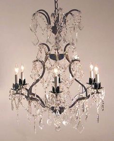 a crystal chandelier hanging from the ceiling