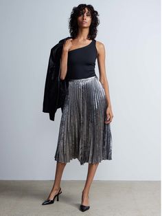 High Rise Pleated Metallic Skirt | New York & Company Trendy Pleated Asymmetrical Skirt, Chic Pleated Asymmetrical Skirt For Party, Chic Asymmetrical Pleated Skirt For Party, Trendy Asymmetrical Pleated Skirt, Trendy Flared Skirt For Night Out, Casual Pleated Party Skirt With Lining, Asymmetrical Pleated Skirt For Night Out, Trendy Flowy Skirt For Night Out, Casual Pleated Lined Skirt For Night Out