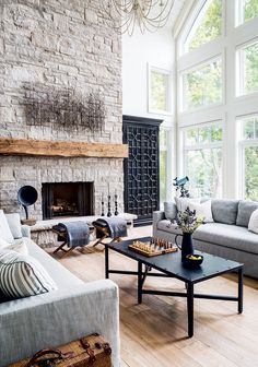 a living room filled with furniture and a fire place