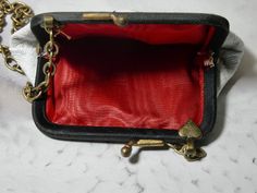 One of a Kind vintage white coin purse. This coin purse is really in perfect condition, which is rare. I added a piece of vintage jewelry to add a bit of charm. It would make the perfect gift. I T E M ∙ S P E C I F I C A T I O N S - PURSE SIZE: 4" x 3" frame opens about 2" and you could put something little inside - CHAIN LENGTH: 52" total length brass link chain, you can double the chain and make the necklace short C A R E ∙ T I P S: We don’t want your special moment to fade. To maintain the qu Vintage Style Coin Purse Pouch For Personal Use, Gold Coin Purse With Coin Pocket As A Gift, Vintage Pouch Coin Purse For Personal Use, Classic Rectangular Coin Purse For Gift, Classic Rectangular Coin Purse As Gift, Gold Coin Purse As Gift, Classic Gold Coin Purse As Gift, Vintage Bags With Card Slots As Gift, Retro Compact Coin Purse As Gift