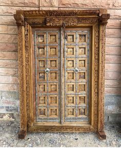 an old wooden door with intricate carvings on it