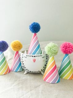 "POM PARTY HATS! You asked and I heard ya - you need a hat for a little (or big) head? I've got you covered. Hats are made of premium paper with a printed pattern, Poms are handmade. Hat measures 2.5\" across and 3.5\" tall. Hats look good on babies, adults even pets! Hats come assembled with a white elastic band - you can remove it if you wish to use a bobby pin or something else to hold it in place. LISTING IS FOR 1 POM HAT Need something custom? Message me! $1.50 extra per custom item Need a Cute Multicolor Hat For Birthday, Cute Multicolor Birthday Hat, Playful Curved Brim Hat For Birthday, Playful Curved Brim Birthday Hat, Playful Curved Brim Hat For Birthdays, Playful Multicolor Hats For Gifts, Fun Multicolor Birthday Hats, Novelty Multicolor Birthday Hat, Fun Multicolor Costume Hats And Headpieces