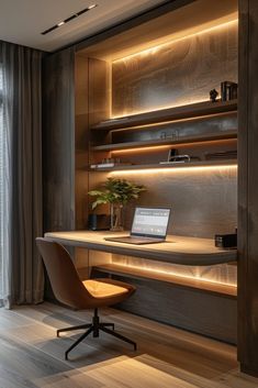 a laptop computer sitting on top of a wooden desk next to a plant in a vase