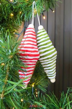 two ornaments hanging from a christmas tree