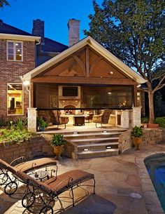 an outdoor living area next to a swimming pool