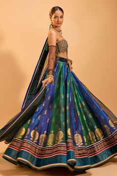 Green and blue attached cancan panelled lehenga with foil block print and embroidery details. Paired with a padded sequin embroidered tasseled blouse and embroidered border dupatta. - Aza Fashions Designer Fusion Lehenga With Zari Work, Fusion Style Lehenga With Zari Work For Diwali, Fusion Style Lehenga With Pallu For Diwali, Multicolor Meenakari Lehenga For Party, Fusion Style Lehenga For Reception And Festivals, Festive Fusion Sets With Zari Work, Fusion Style Lehenga With Traditional Drape And Cutdana, Designer Fusion Lehenga With Traditional Drape, Fusion Style Choli With Zari Work For Festive Occasions