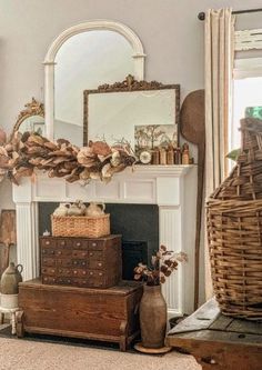 a living room filled with furniture and a mirror on top of a fireplace mantel