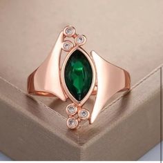 a green ring sitting on top of a box