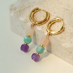 This vibrant bracelet features colorful candy pieces for a playful and charming accessory. Each cube comes in a range of hues, creating a delightful rainbow effect that adds a pop of joy to any outfit. With its cheerful design and adjustable fit, it's perfect for adding a touch of fun to your day. Embrace life's colorful moments with this rainbow candy cube drop hoop earrings. Metal: 18K Recycled Gold Plated On Brass Gemstone: Multi Stone Earrings Dimensions: Length 45mm Single Weitgh: 4.5g Drop Hoop Earrings, Rainbow Candy, Edison Pearls, Earrings Metal, Embrace Life, Earrings Hoop, Colorful Candy, Tiger Eye Stone, Recycled Gold