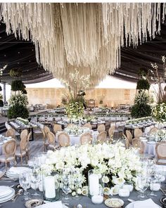 an image of a table set up with flowers and candles for a wedding or special event