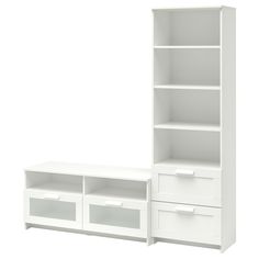 a white bookcase with two drawers next to it