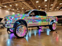 a truck with holographic paint is parked in a garage