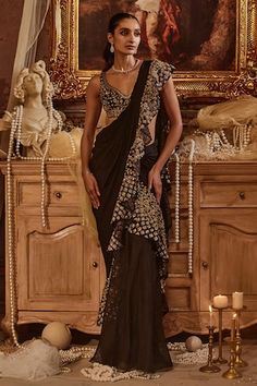 Black pre-draped saree with zari thread, sequin, cutdana embroidered ruffle border. Paired with sleeveless embroidered padded blouse. - Aza Fashions Designer Black Draped Saree, Traditional Black Draped Saree, Black Draped Saree With Sheer Dupatta, Black Bollywood Style Pre-draped Saree, Black Bollywood Pre-draped Saree, Evening Dupatta With Cutdana And Draped Style, Evening Draped Dupatta With Cutdana, Evening Draped Cutdana Dupatta, Festive Black Pre-draped Saree