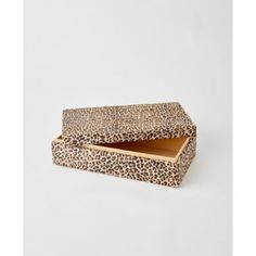 the leopard print box is open and has an empty drawer in it, on a white background