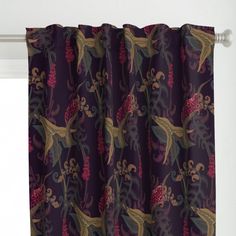 a purple curtain hanging on the side of a window with red flowers and green leaves