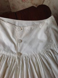 "warm white colored antique under skirt from the 1880s with beautiful knit work lace. this skirt is very strong and wearable. initials M.R. are embroidered at the waist. waist 70 cm 27,5\" length 92 cm 36\" there is room to make the skirt 10 cm longer." Vintage Full Skirt In Crinoline, White Buttoned Skirt For Daywear, Winnie Foster, Petticoat Skirt, Knitted Lace, Under Skirt, Fashion Sites, Vintage Wardrobe, Antique Clothing