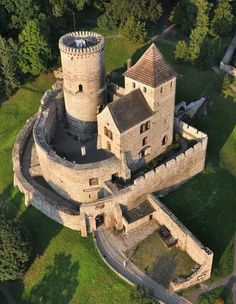 an aerial view of a castle with two towers