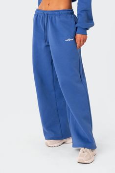 PRODUCT INFO Sweatpants Low rise waist Adjustable waistband Wide leg Embroidered logo Matching set Cotton, Polyester Model wears size S Model height is 5'9 Item care: Wash with similar color Blue Wide Leg Sweatpants, Matching Set Outfit Sweats, Wide Sweatpants, Sweatpants Blue, 2024 Wardrobe, Cute Sweats, Cute Sweatpants, Blue Sweatpants, Wardrobe Wishlist