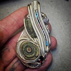 Pendent made of .999 fine silver. Contains, moldavite, golbi desert agate, rubys, garnet, topaz, tanzanite, and grape agates. Fine Silver, Aliens, Pendant Necklaces, Garnet, Topaz, Jewelry Necklace Pendant, Agate, Jewelry Necklaces, Necklaces