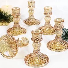 PRICES MAY VARY. Size Specification: The hole diameter of the 6-piece taper candlestick holders is 7/8 inches and the depth is 3/4 inches. The base diameter is 3.15 inches and the height is 4.15 inches. The candlestick holders is suitable for a variety of candles Fall Table Decorations: Tapered candlestick holders are suitable for anywhere. Elegant gold, shiny appearance. A variety of colors and designs meet the various needs of customers. The gorgeous design is perfect for weddings, Thanksgivin Gold Candle Stick Holders, Gold Taper Candle Holders, Gold Taper Candles, Gold Candlestick Holders, Vintage Candlestick Holders, Tafel Decor, Gold Candle Sticks, Gold Candle Holders, Wedding Party Table