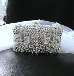 Elevate your evening look with this stunning Silver Evening Clutch Bag adorned with sparkling Swarovski Crystals. Perfect for brides looking for a touch of glamour on their wedding day, or anyone attending a formal event. This elegant handbag exudes sophistication and style, making it a must-have accessory for any special occasion. Make a statement and stand out with this timeless and glamorous piece that will surely turn heads wherever you go. Size: 18x11x6cm.This luxurious clutch can fit iPhon Rectangular Crystal Evening Bag For Wedding, Crystal Rectangular Evening Bag For Weddings, Glamorous Wedding Evening Bag With Rhinestones, Luxury Sparkling Evening Bag For Wedding, Elegant Sparkling Evening Bag For Events, Elegant Sparkling Evening Bag, Elegant Sparkling Wedding Bags, Crystal Clutch Evening Bag For Wedding, Sparkling Clutch Evening Bag For Wedding