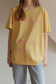 Looking for a comfortable and laid-back fit? Look no further than this Tired Girl T-Shirt! With a touch of vintage charm and playful lettering combinations, this shirt is perfect for warm days. Made with soft and durable 40 count cotton and woven with polyester, it has a refreshing feel and enhanced durability. Plus, it's been washed multiple times for that extra touch of softness. The double-layer fabric from Hotel 827 ensures a delicate and rich print of our protagonist, Jules, a relatable cha Spring Letter Print Relaxed Fit T-shirt, Spring Short Sleeve T-shirt With Lettering, Everyday Short Sleeve Tops With Lettering, Oversized Yellow T-shirt With Letter Print, Retro Relaxed Fit Tops With Lettering, Summer Everyday T-shirt With Embroidered Text, Yellow Cotton T-shirt With Text Print, Yellow Relaxed Fit T-shirt With Text Print, Relaxed Fit Yellow T-shirt With Text Print