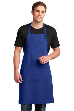 a man wearing an apron and black t - shirt is standing with his hands in his pockets