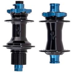 the front and rear suspensions of a blue car, with two black hubs