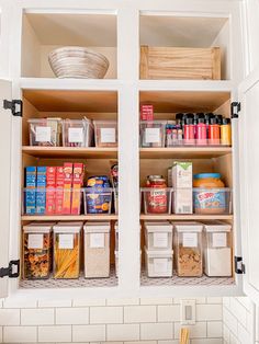 an organized pantry with lots of food in the cupboards and containers on the shelves