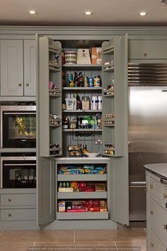 an open pantry in the middle of a kitchen