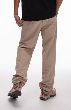 Pure cotton with a hint of stretch keeps you moving comfortably in these tapered pull-on pants that look smart from work to the weekend. 15" leg opening; 13" front rise; 17" back rise Elastic waist Front slant pockets; back welt pockets 98% cotton, 2% elastane Machine wash, line dry Imported Relaxed Fit Straight Chinos For Streetwear, Relaxed Fit Chinos For Streetwear With Straight Hem, Urban Relaxed Fit Tapered Leg Chinos, Relaxed Fit Pull-on Pants, Tapered Leg Chinos With Side Pockets For Streetwear, Casual Streetwear Work Pants With Straight Hem, Casual Chinos With Pockets And Standard Cut Leg, Urban Bottoms With Straight Hem For Everyday, Casual Straight Hem Work Pants