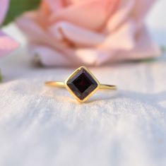 D E T A I L S - Stone: Natural Garnet Stone Shape: Cushion - Square Material: Sterling silver The fit: True to US ring size Finish: Smooth and Gold Plated to a high shine S H I P P I N G & P R O D U C T I O N - My current production time is 2-6 business days, which means after those days are up, your order ships! I make everything custom to order, by hand, but I promise you it's worth the wait! R U S H - M Y - O R D E R - If you're in a rush to get your pretty new pieces, please send me a me Garnet Solitaire Ring As Gift, Garnet Solitaire Jewelry As Gift, Garnet Solitaire Jewelry Gift, Garnet Open Ring Birthstone Gift, Garnet Open Ring Birthstone Ring, Promise Ring With Hallmarked Garnet Birthstone, Princess Cut Gemstone Rings For Gifts, Garnet Birthstone Diamond Ring For Gift, Sterling Silver Ruby Ring With Vs Clarity For Gift