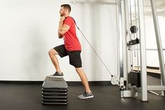 a man is doing exercises on a machine