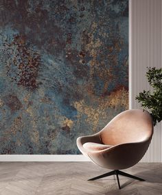 a chair sitting on top of a wooden floor in front of a wall covered in rust