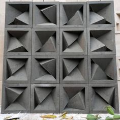 a cement wall with many different shapes and sizes