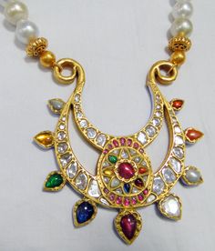 Vintage antique 23 K solid gold and natural Navratna gemstones set large pendant strung together with pearls and gold beads. Great one of type collection piece in very good condition. Length-Free size, Size of pendant-10/9 cm, gross weight-137 grams, pendant weight only-76 grams, Material-23 K gold, Natural uncut Diamonds, and Natural Navratna gemstones. Gemstone Pendant Necklace, Gold Anklet, Ankle Chain, Silver Flats, Gold Flats, Uncut Diamond, Gemstone Necklace Pendant, Chains For Men, 22k Gold