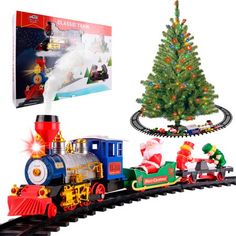 a toy train with santa claus and a christmas tree on the track next to it