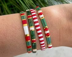 three bracelets with candy canes on them