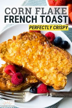 two pieces of french toast on a plate with berries