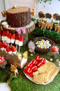 a table topped with lots of food and desserts