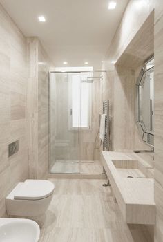 this bathroom has marble walls and flooring