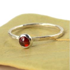 Garnet Hammered Band Stacking Ring - 925 sterling silver ring with 4mm red garnet cabochon - Stackab Garnet Birthstone Ring Gift, Garnet Birthstone Ring With Round Band As Gift, Adjustable Round Garnet Ring, Adjustable Garnet Ring, Red Birthstone Stackable Rings, Red Birthstone Ring With Round Stone For Gift, Garnet Birthstone Ring As A Gift, Round Cabochon Garnet Jewelry, Round Garnet Cabochon Jewelry